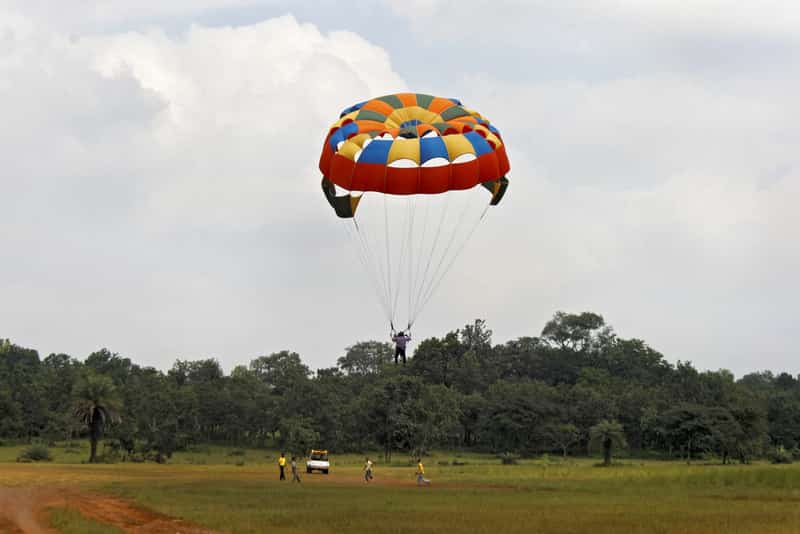 An adventure seeker taking off in a parasail