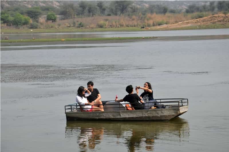 Tourists enjoying a boat ride at the Damdama Lake