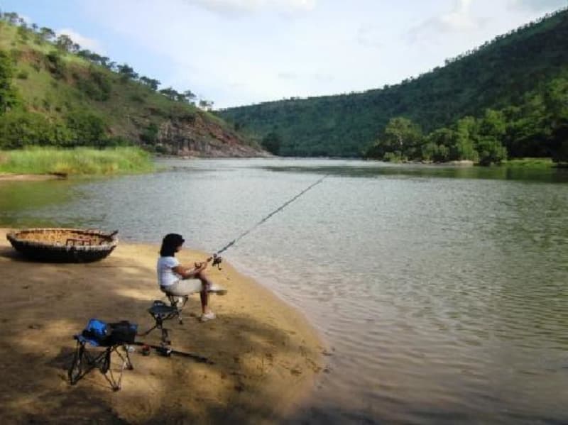 A camper waiting patiently to catch a fish