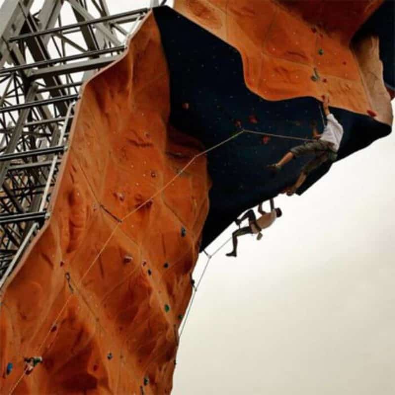 Patrons climbing the artificial wall