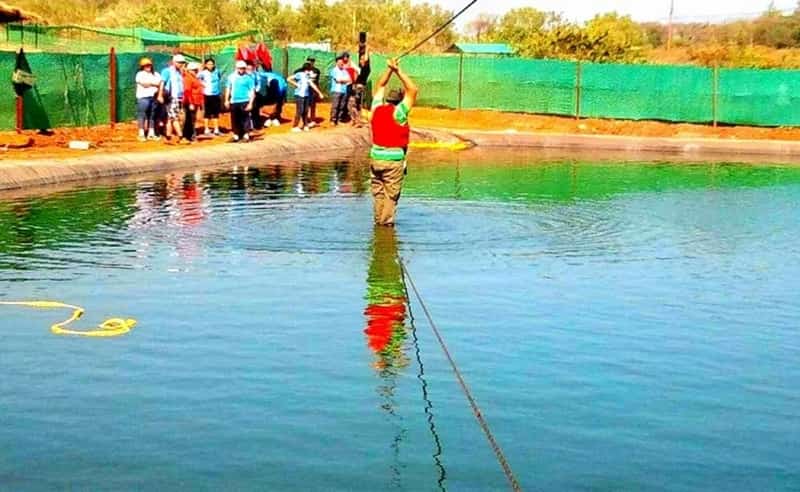 Patrons engaged in lake crossing activity