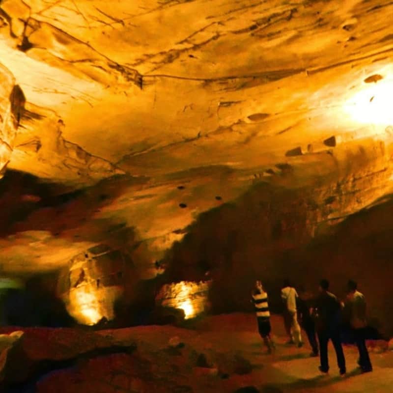 Visitors trekking in the caves of Antargange
