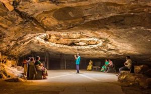 Visitors gathered beneath the meditation hall at Belum Caves - Treebo Blog