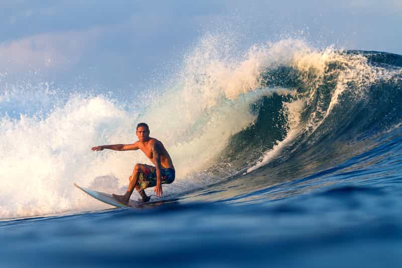 A man surfing in Gokarna