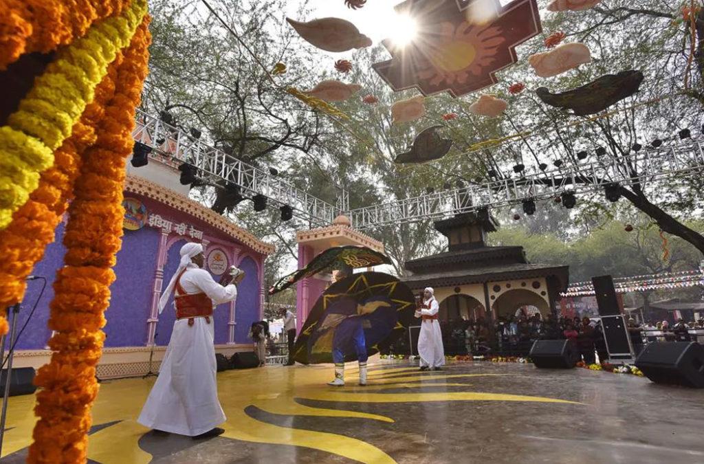 Performers performing at the Surajkund Mela
