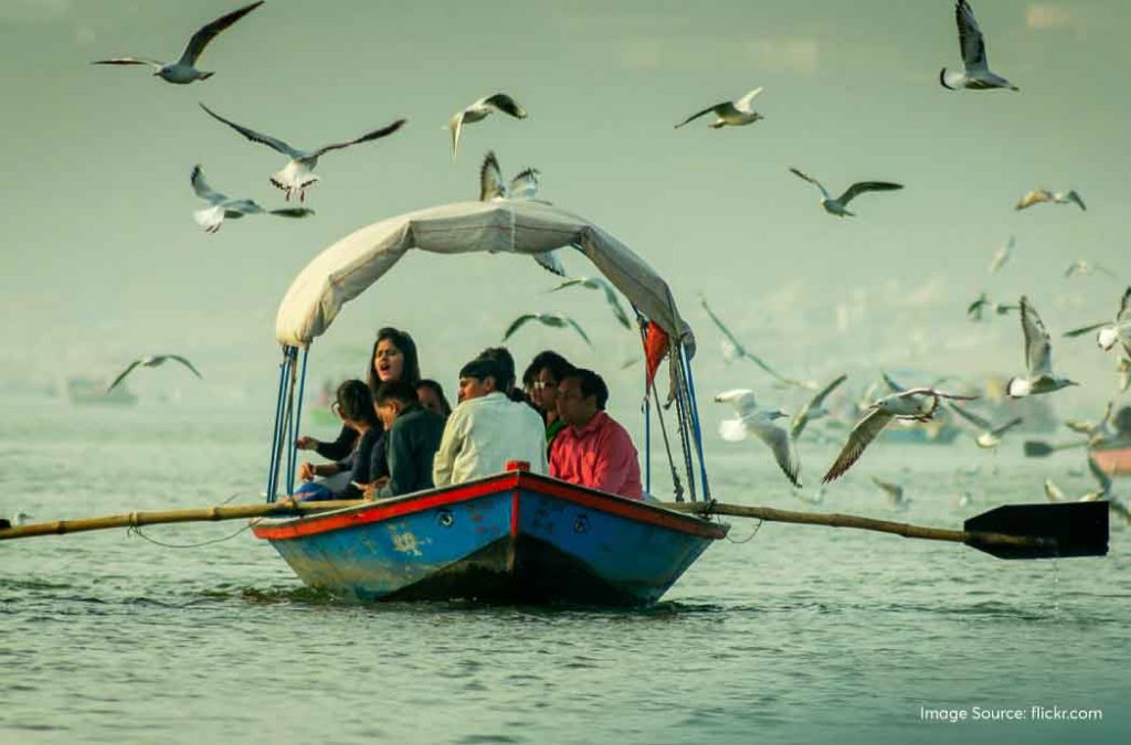 Reach Triveni Sangam by boat.