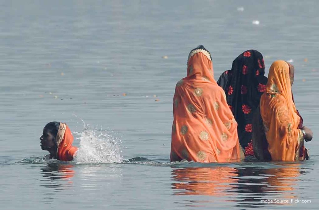 Women Taking Holy Dip in Sangam.