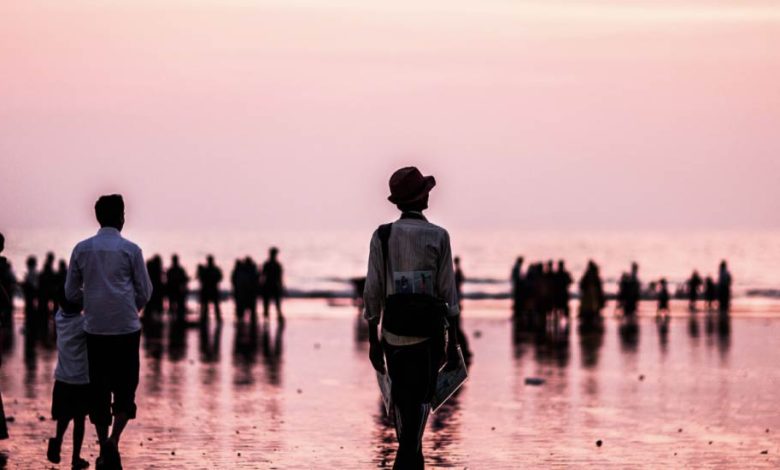 Visit Juhu Beach, a popular tourist attraction in Mumbai.